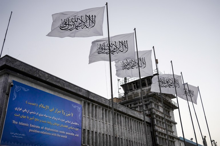 FILE - Taliban flags fly at the airport in Kabul, Afghanistan, on Sept. 9, 2021. The Taliban have waged a systematic assault on the freedom of Afghanistan's people, including women and girls experiencing “immeasurably cruel” oppression, the U.N.'s human rights chief said Tuesday, Sept. 12, 2023. (AP Photo/Bernat Armangue, File)
